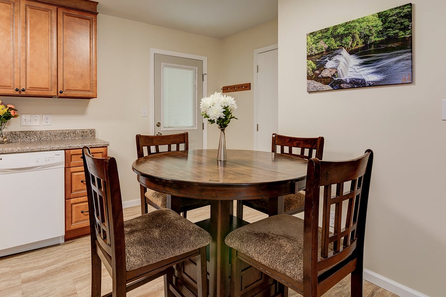 Expandable high top wood table for 6 guests.Padded high top chairs for comfort.
