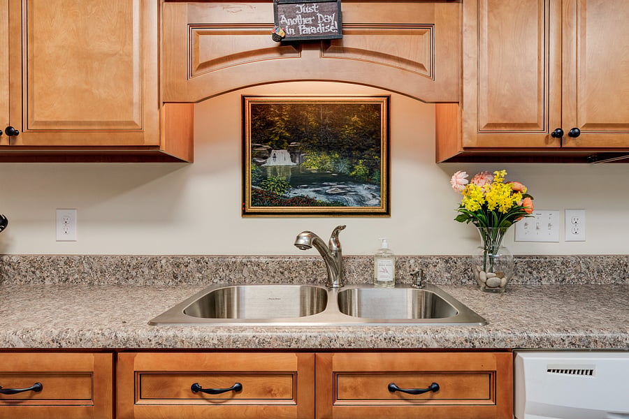 Kitchen sink, dishwasher next to it.