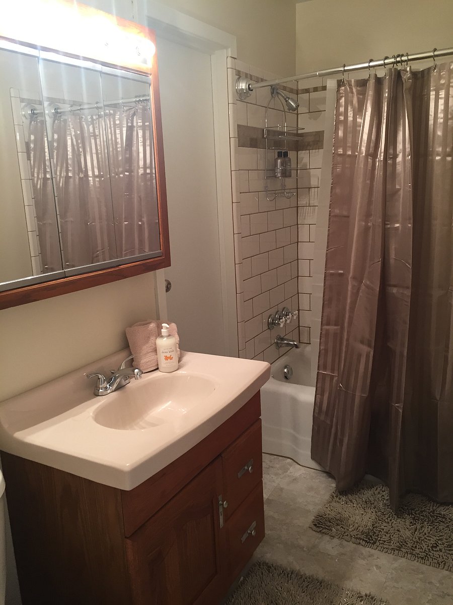 Guest bathroom #2 offers tile tub/shower, vanity, toilet and plenty of fresh clean towels and some toiletries.