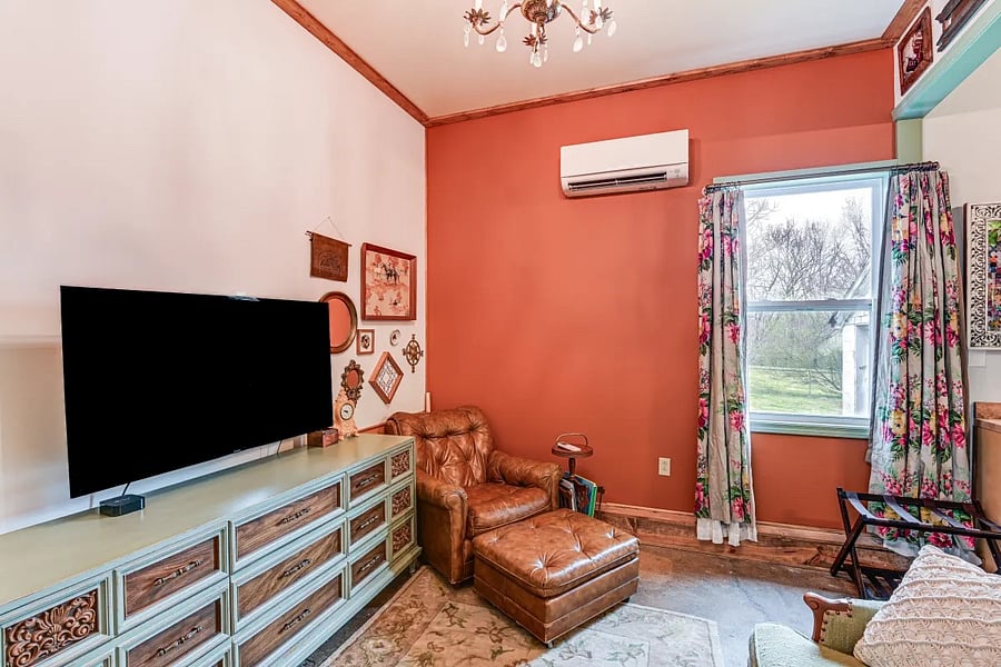 Living room with drawer space. TV with Apple TV.