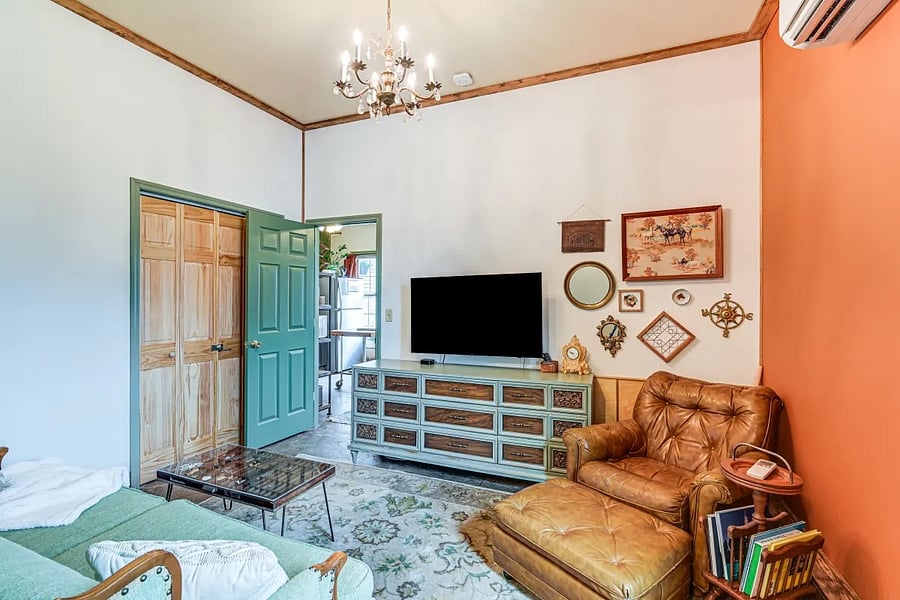 Living area exit to kitchenette & dining.