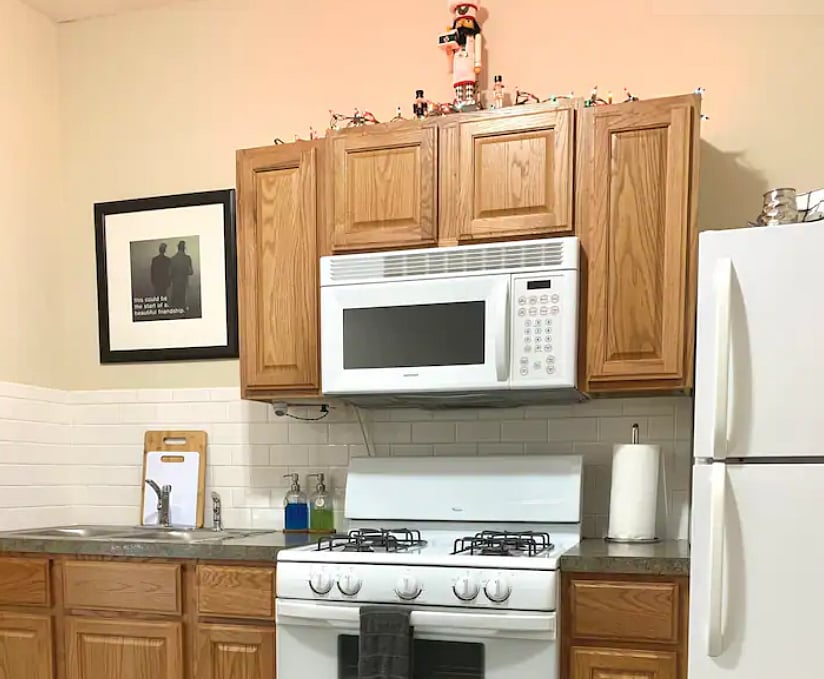 Full-size kitchen appliances. Sink does not have a garbage disposal for food waste.