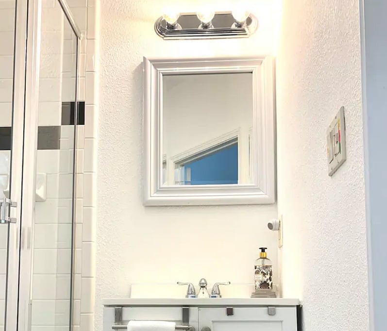 Well-lit bathroom vanity. Under-sink storage.