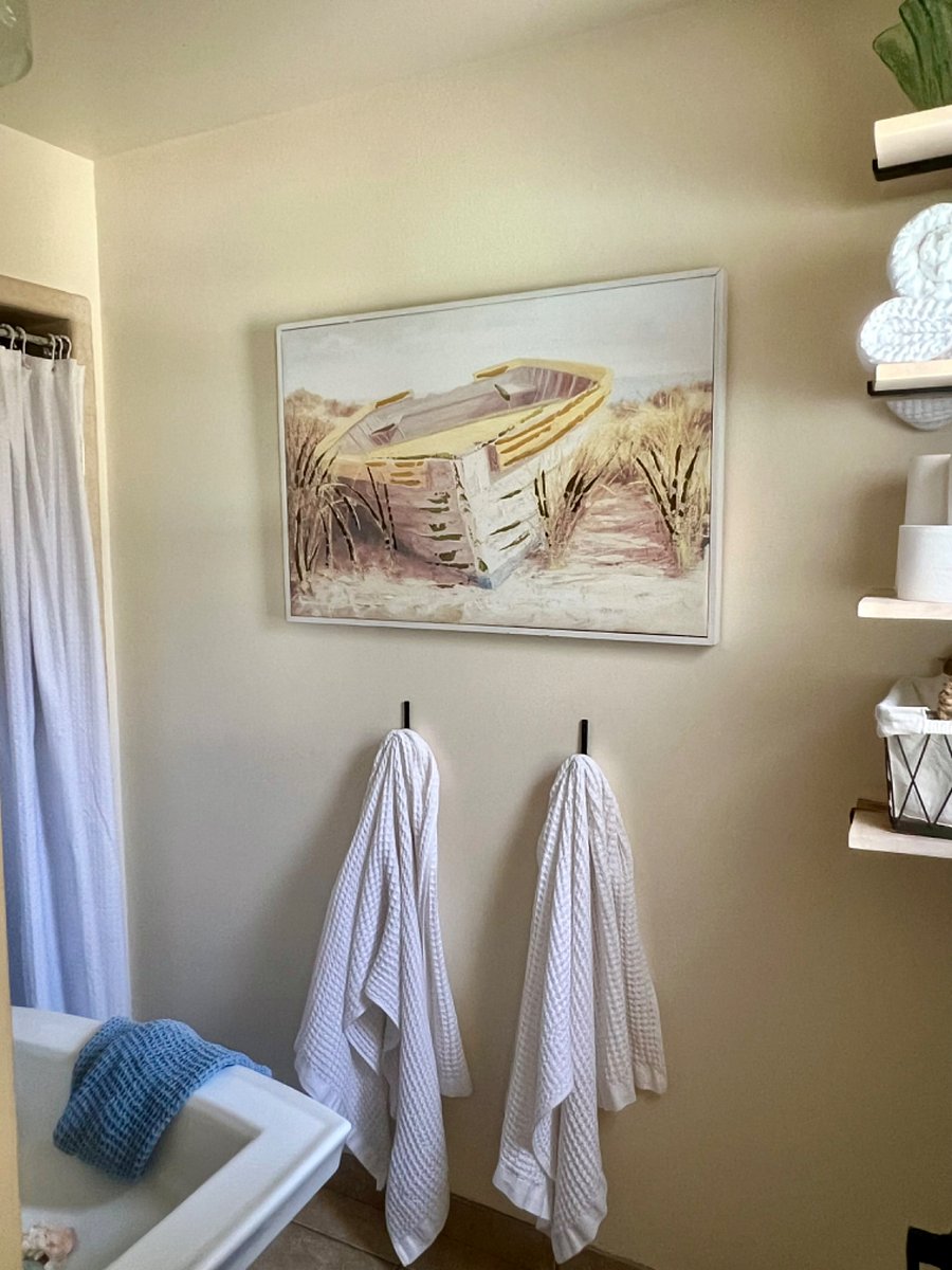 Private bathroom nicely decorated to feel as though you are on vacation at the coast