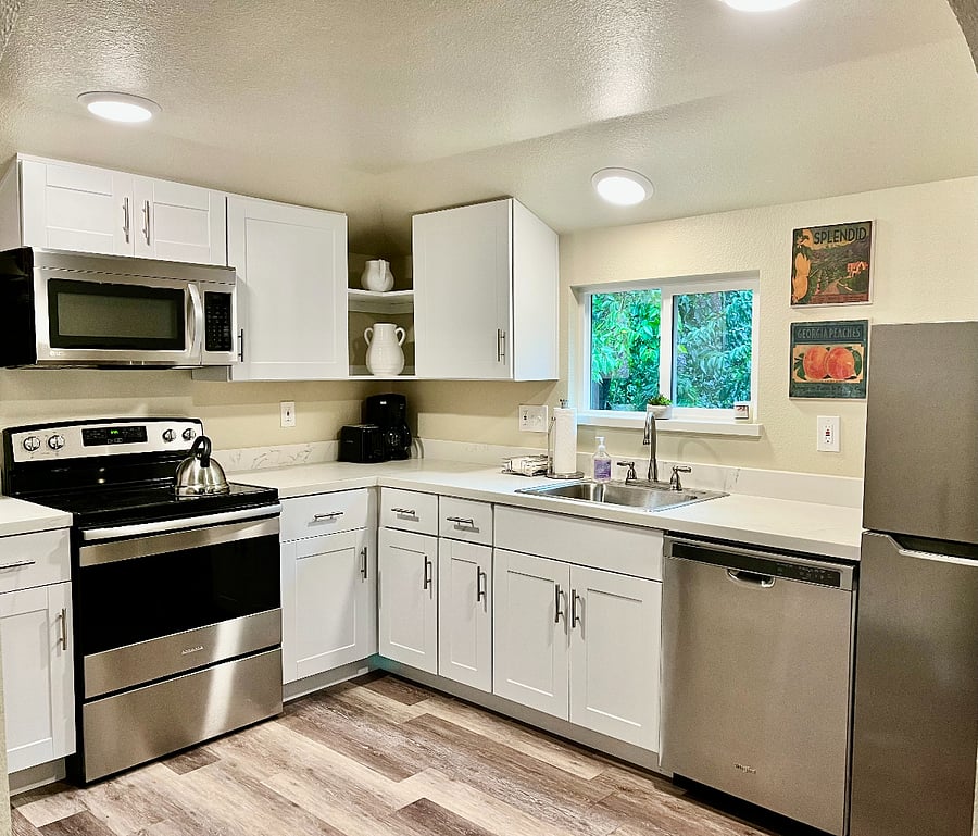 Kitchen, radiant stove top and oven, microwave, garbage disposal and dishwasher