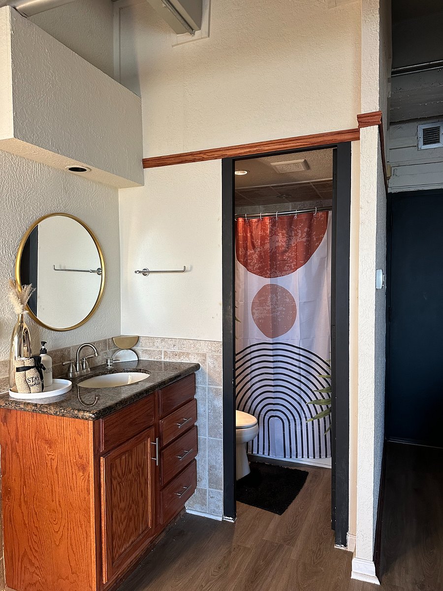 Vanity area and separate bathroom.