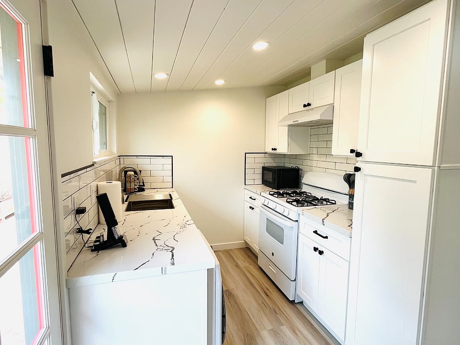 Kitchen with compact all-in-one washer/dryer