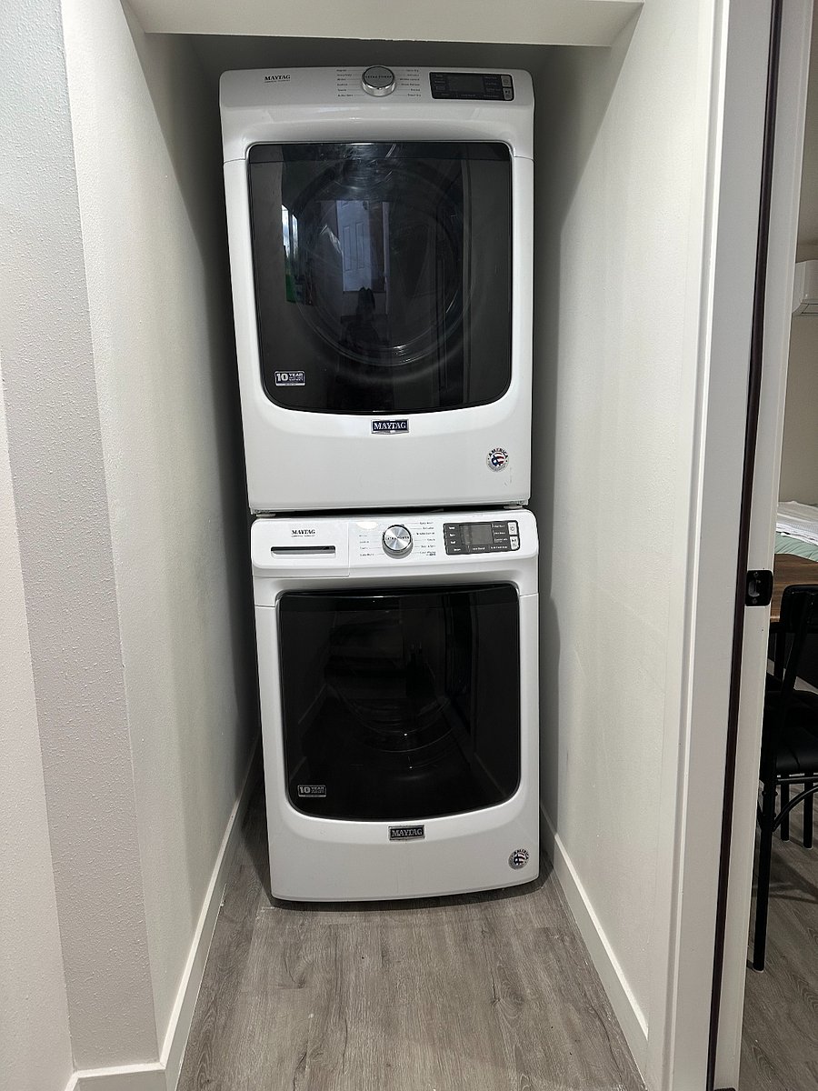 Washer and Drying in its own Laundry Nook outside of the bedroom space