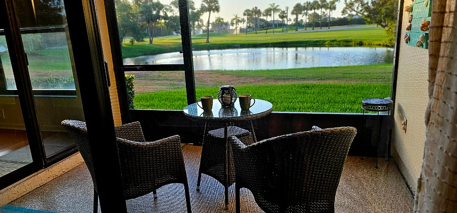 Enjoy coffee in the mornings or cocktails in the evenings on the screened in porch with views of wildlife and the golf course