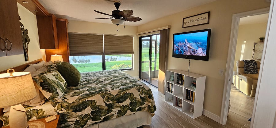 Wake up to views of the wildlife around the pond and golfers on the 10th hole as well as access to the screened in porch