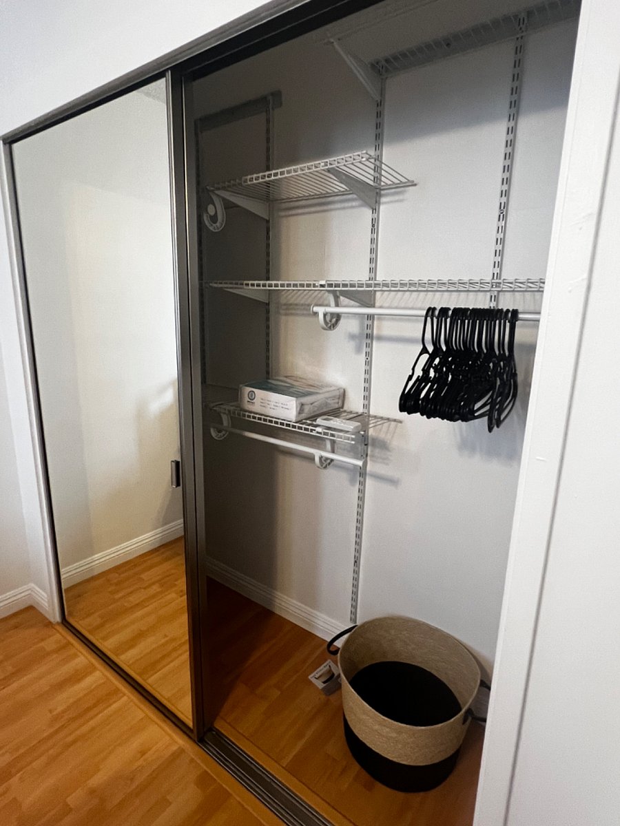 closet shelving added to save space in bedroom