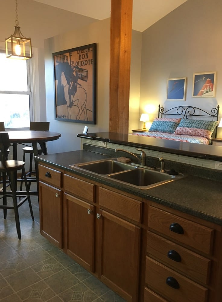 Eat-in kitchen with full-size sink and appliances: refrigerator, oven/range, microwave/range fan, garbage disposal. Under-cabinet lighting, ceiling lights on dimmers.