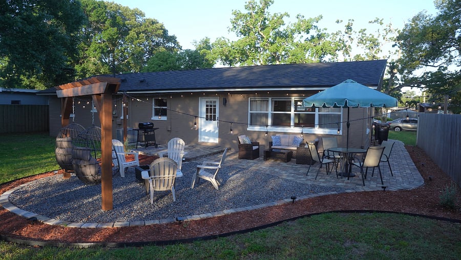 Backyard amenities: BBQ grill (propane), outdoor seating, pergola with swig chairs, and fire pit.