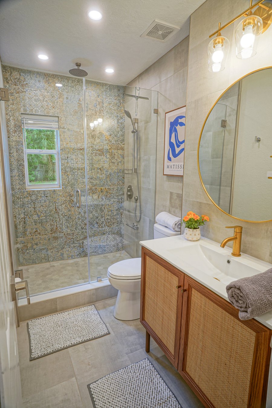 Indulge in impeccably clean bathrooms featuring stylish design and a rejuvenating rainfall shower combo, ensuring ultimate relaxation.