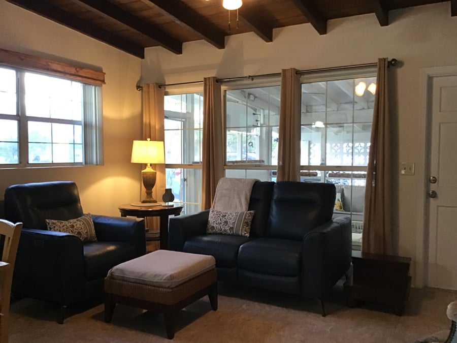Living room, with view of lanai and carport 