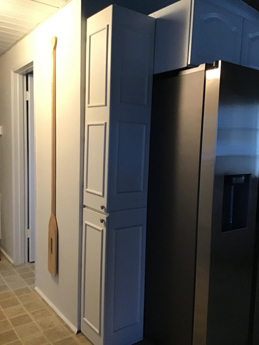 Paper Supplies in cabinets next to fridge