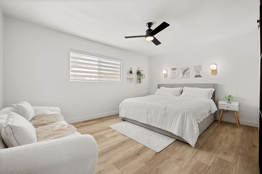 Modern elegant master bedroom w/ King Bed and USB ports on nightstands.