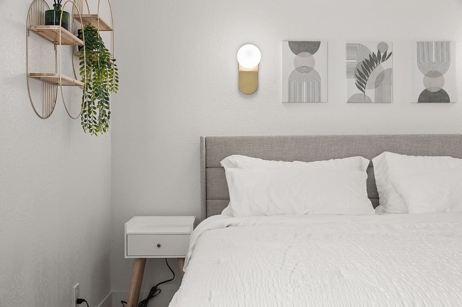 Modern elegant master bedroom w/ King Bed and USB ports on nightstands.