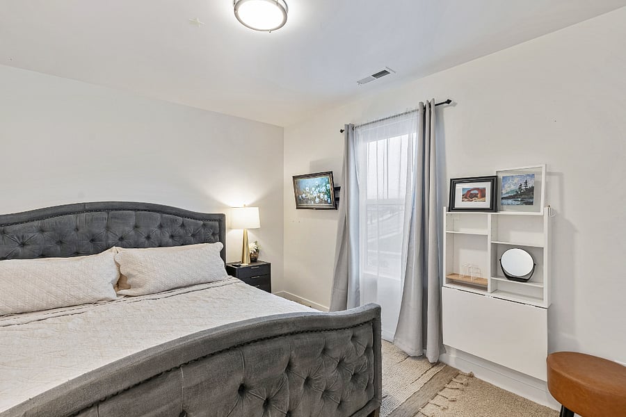 Bedroom #1 - Smart TV, Adjustable desk, and window with blackout shades and black out curtains. 