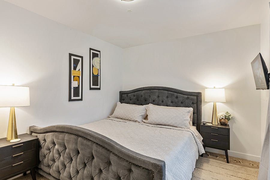 Bedroom #1 - Two nightstands and two lamps.
