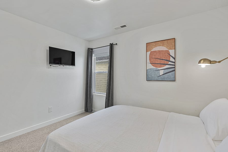 Bedroom #3 - Smart TV and window blackout shades with blackout curtains. 