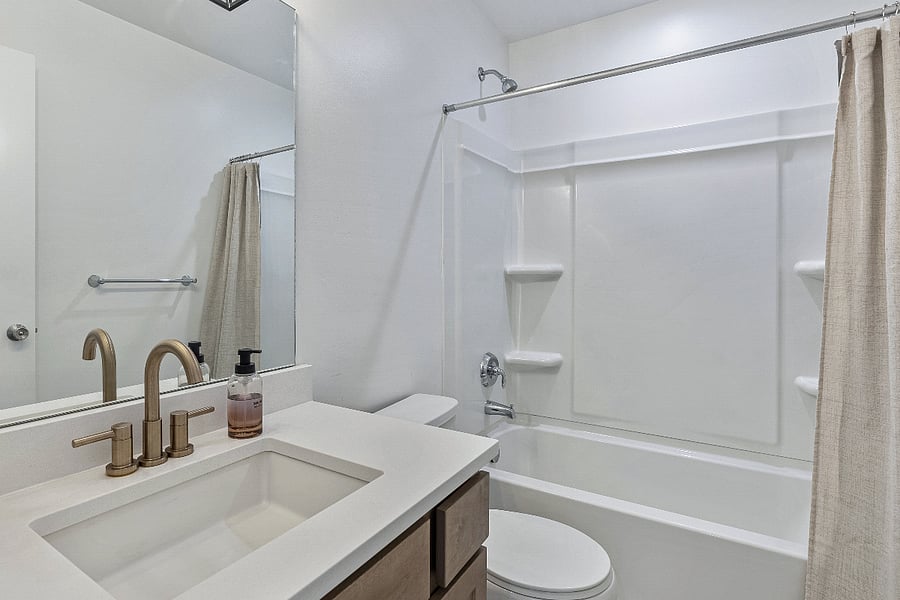 Bathroom #2 - Quartz countertop and full bathtub. 