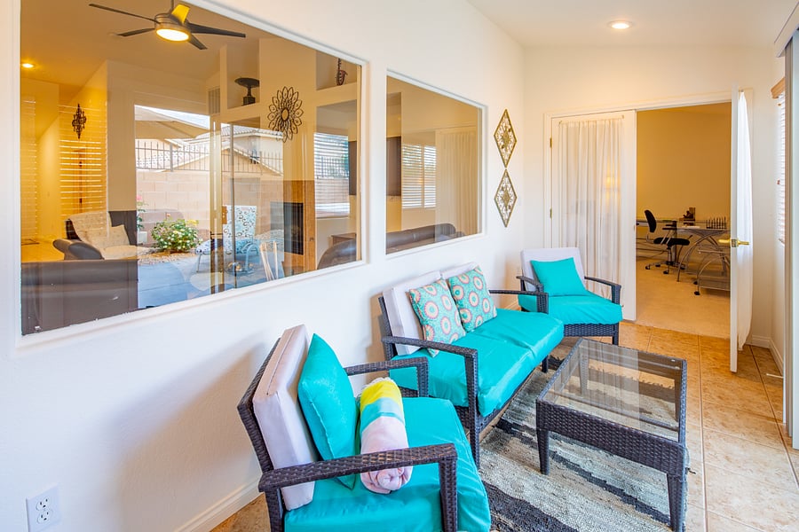 Extra glassed in seating area before exiting to the patio private backyard area