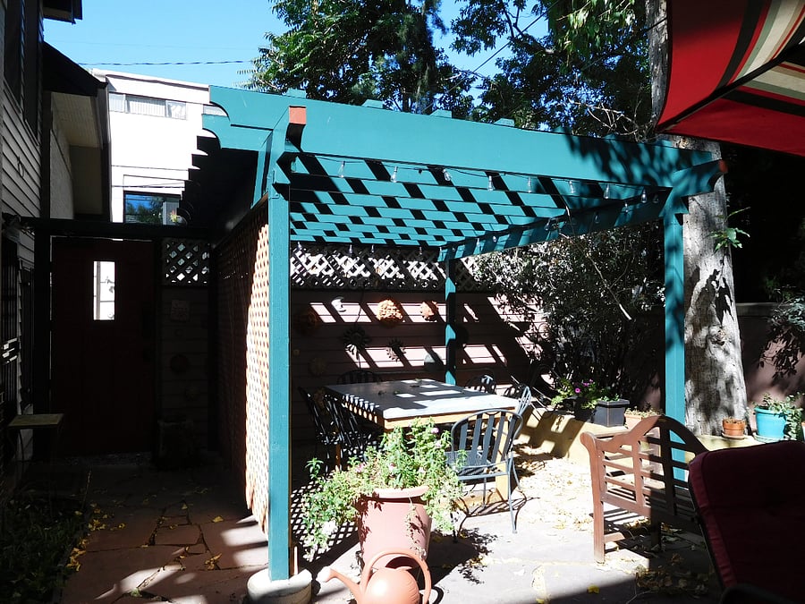 Pergola table seats 6 in shared patio area