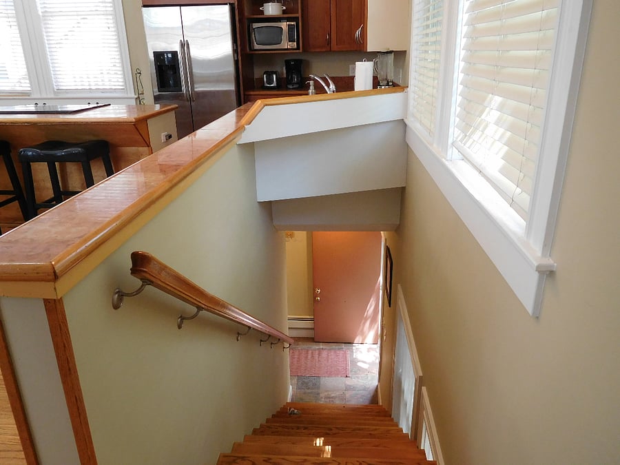 Stair going down from main floor to entry and bathroom
