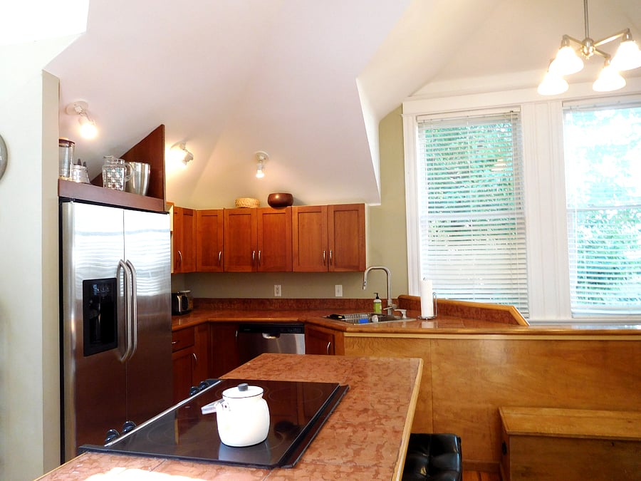 Large windows look out to a large crab apple tree. Great south light but private.