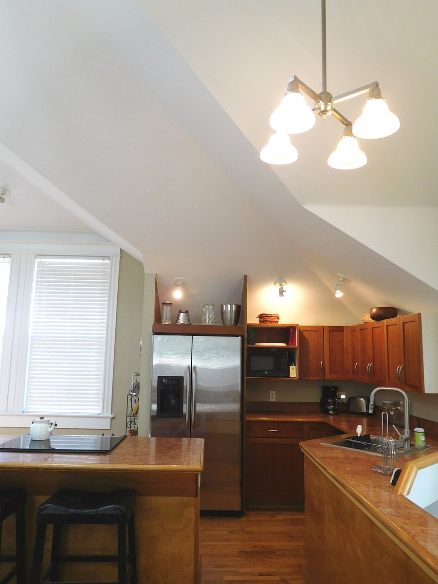 Stainless steel appliances include stove with self-cleaning oven, side by side refrigerator with ice maker, microwave oven, dishwasher.
