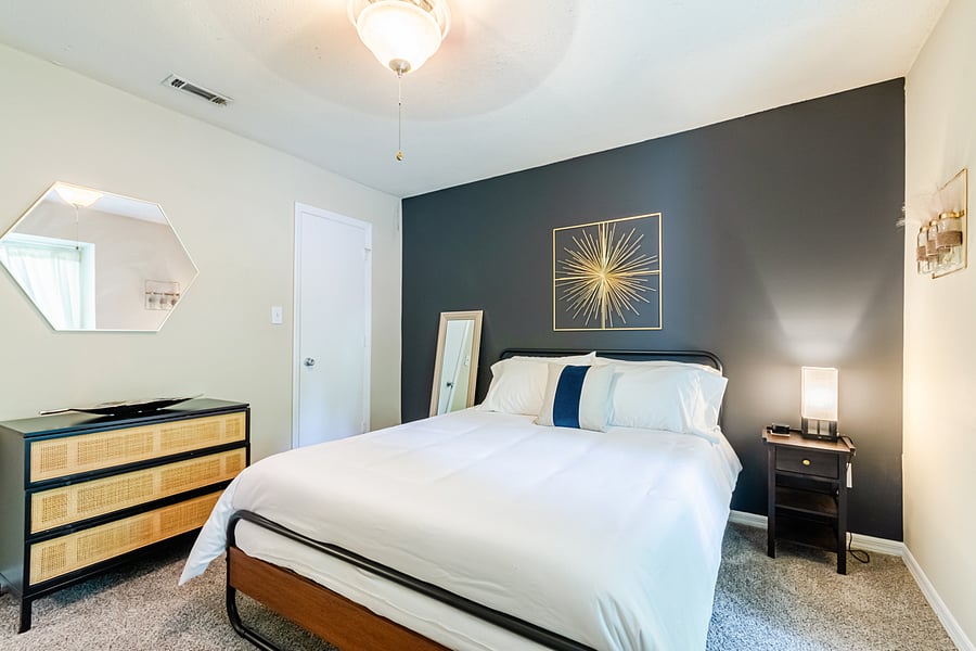Queen sized bed with Zinus mattress and premium linens for the perfect night's rest.