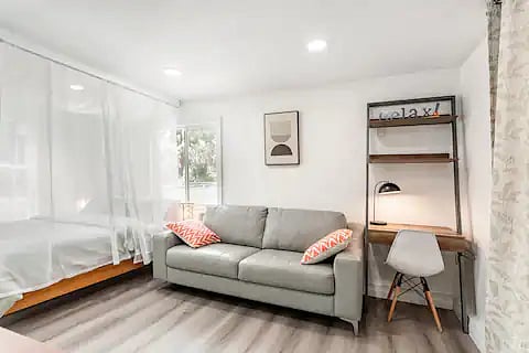 Modern genuine leather sofa, brand new solid wood queen size bed with canopy curtains,  writing desk with book case and task light. Other than bright recessed lights, there are 2 soft ambience lights with cute end tables that fits perfectly. 