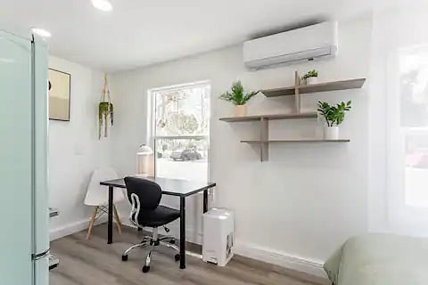 Desk which also funtions as a dining table (with 2 dining chairs plus the task chair). This spot has the best view and light of the entire duplex. Even I want to spend time there :) 