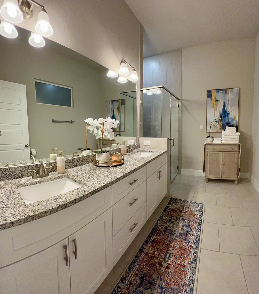 MASTER BATHROOM is VERY spacious and features dual vanity, walk-in shower, and window for natural light.