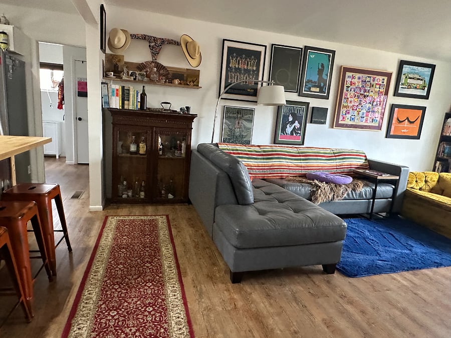 living room/kitchen and entry to pantry and laundry area.
