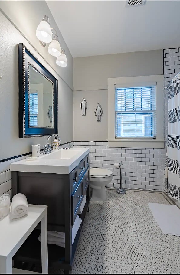 New-renovated bathroom with vanity and tub-shower combo