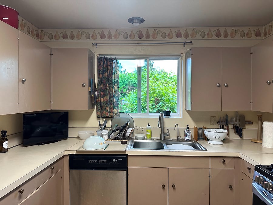 kitchen with window facing the garden and street
