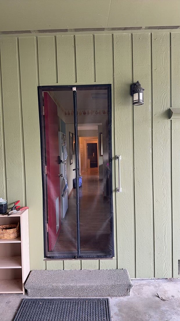 door leading into the kitchen is covered by a screen so door can be left open for air flow.