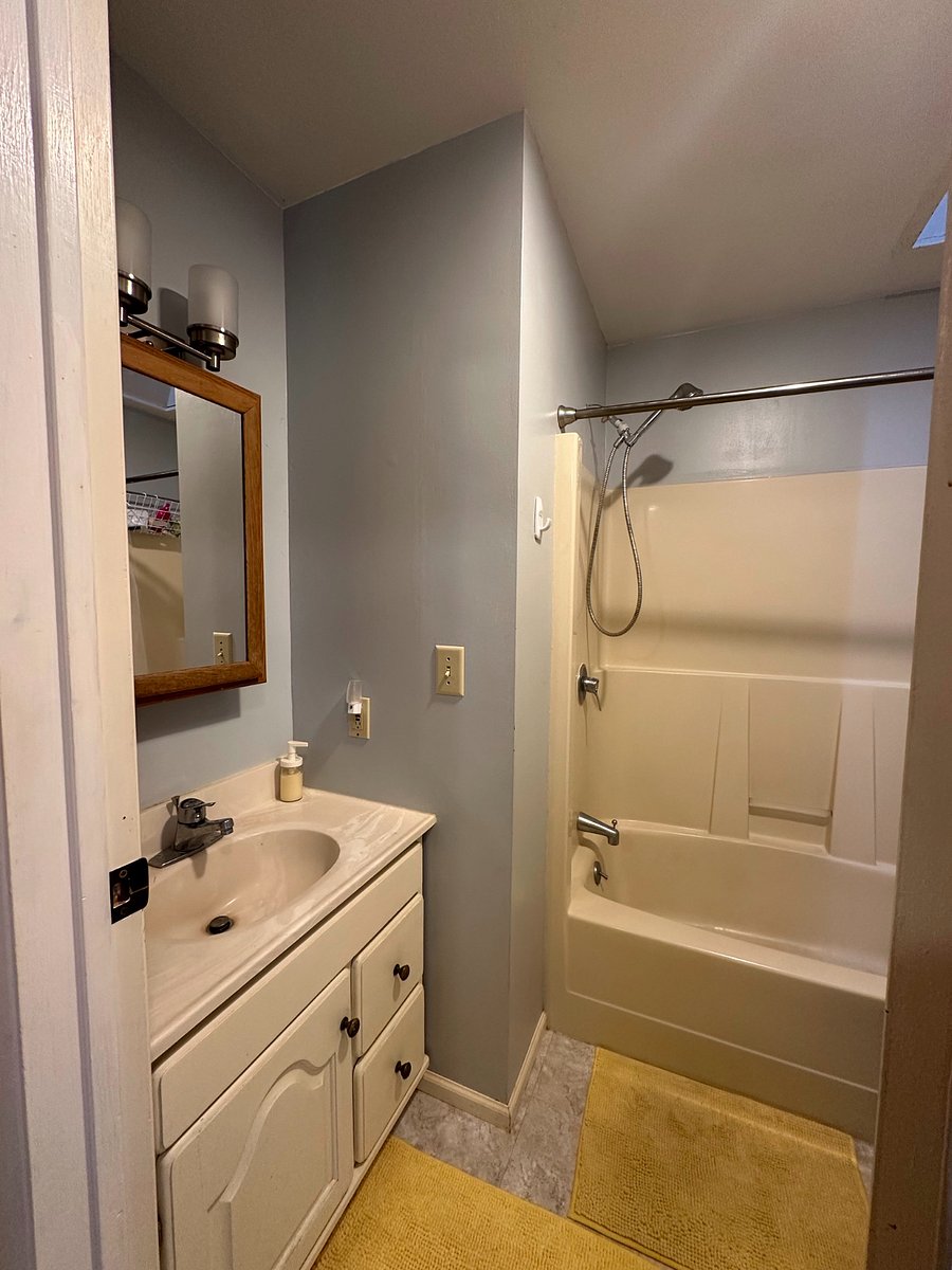 the main bathroom, with shower/tub combo, sink & toilet 