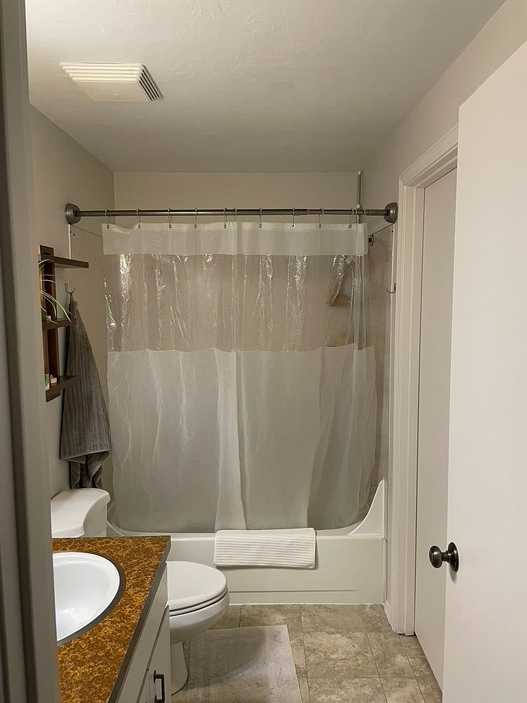 Full Bath - The house has a full bath & a half bath (not shown). The full bath would almost entirely be the guests bathroom. Host to access shower only.