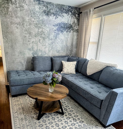 The living room has plenty of natural light which complement the refinished harwood flooring.