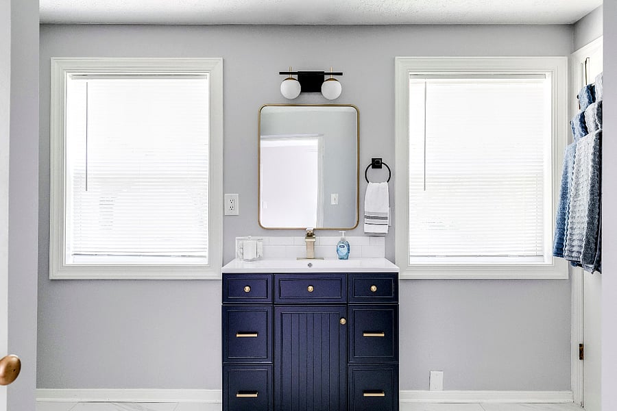 The new vanity in the master bathroom with gold tone hardware has a special drawer that holds the hairdryer (provided)!