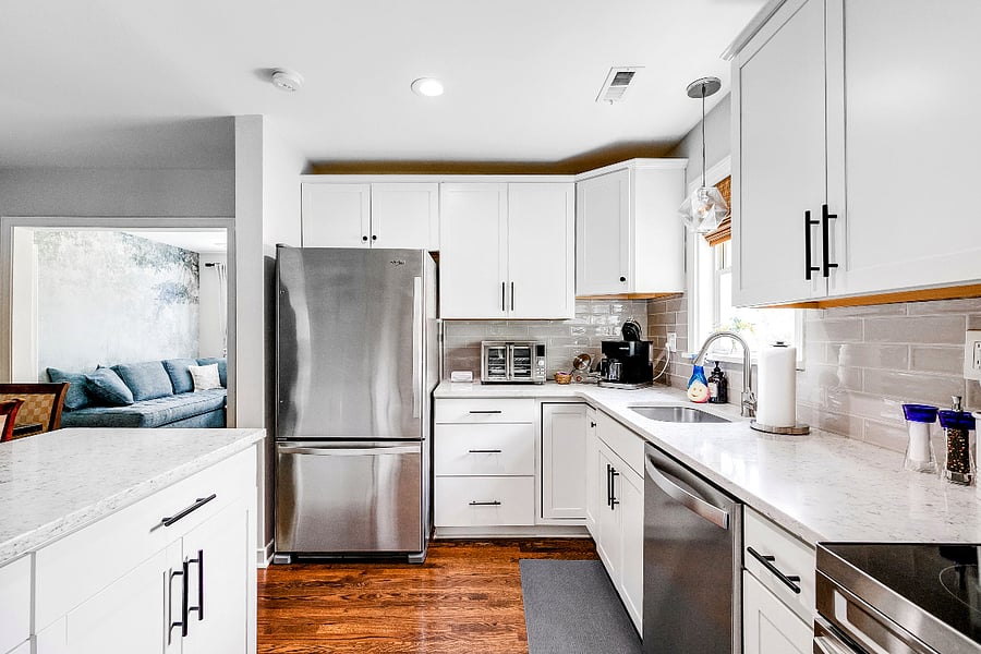 Updated Kitchen with plenty of dishes, cookware, bakeware, crockpot, blender, utensils and  counterspace for prepping meals.  