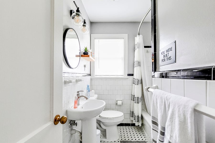 Hallway Full Bathroom with freshly glazed tub. Linen closet in bathroom.