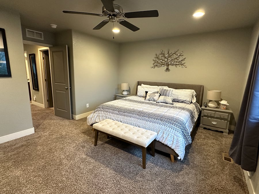 Primary bedroom with king size Posturepedic hybrid mattress
