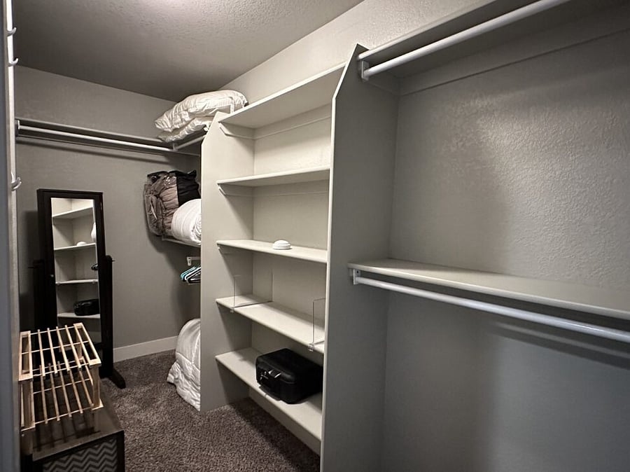 Primary bedroom walk-in closet