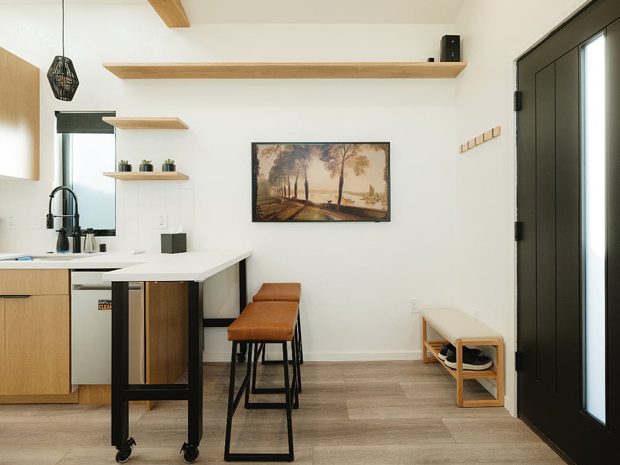 Enjoy meals or work from home at the custom rolling table. Unwind and watch a show on the 55" Samsung Frame TV.