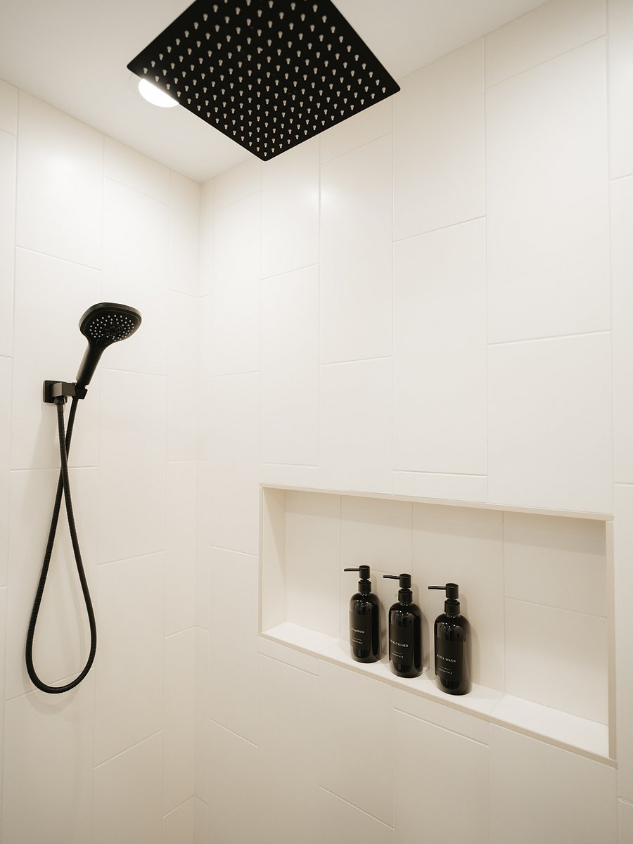 Enjoy a spa-like experience under the 12-inch luxury rainfall shower head. Starter shampoo, conditioner, and body wash included.