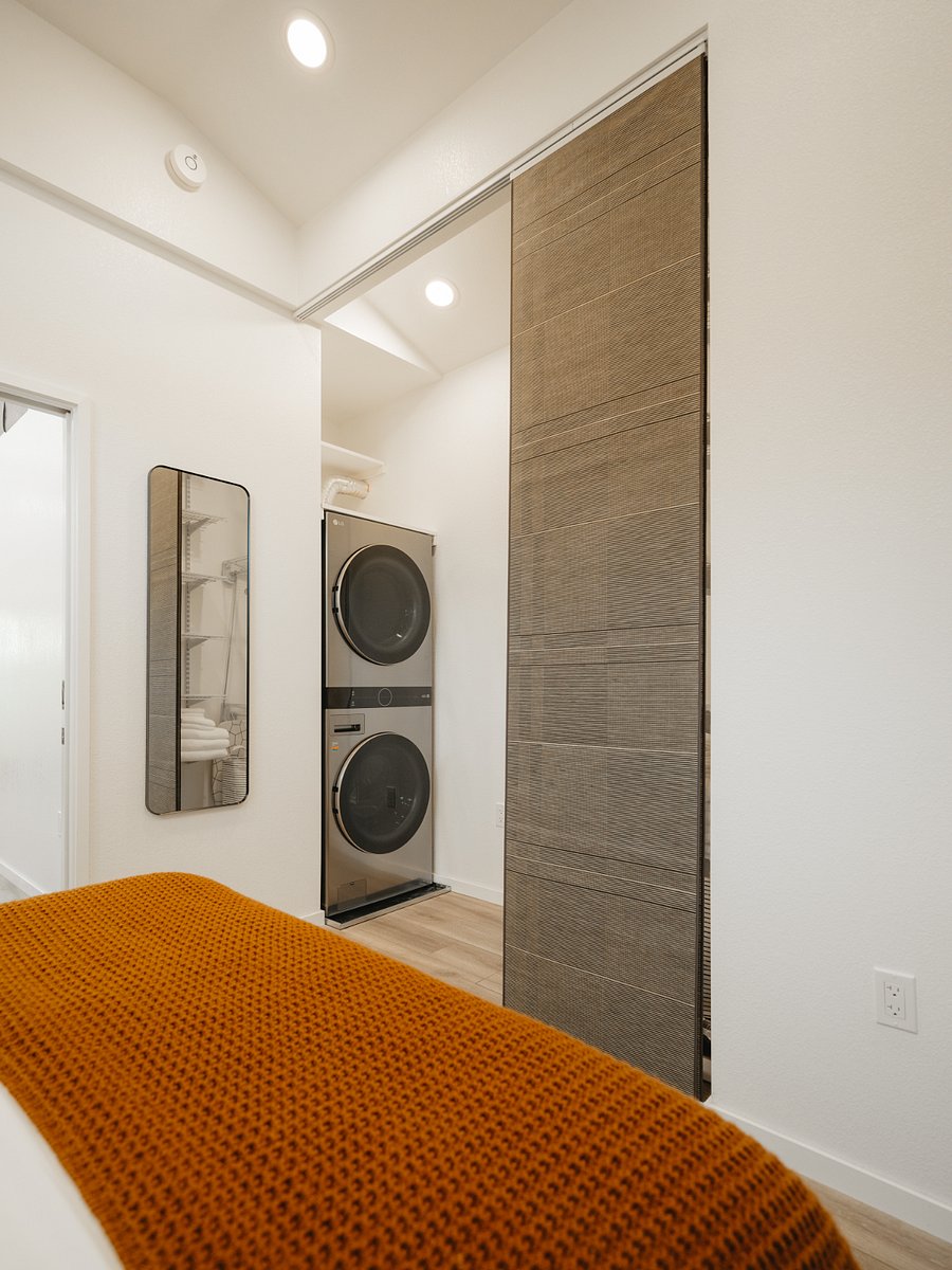 Every inch is maximized inside this ADU, and feels spacious due to vaulted ceilings and plentiful light. Additional storage nooks available above the washer and dryer.